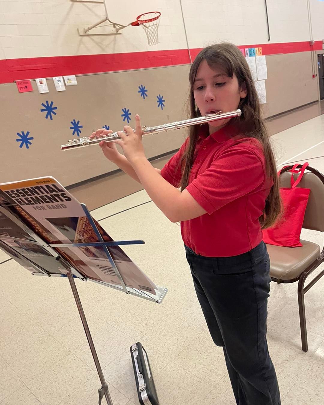 student playing flute